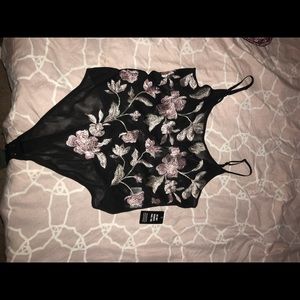 Embroidered rose body suit.